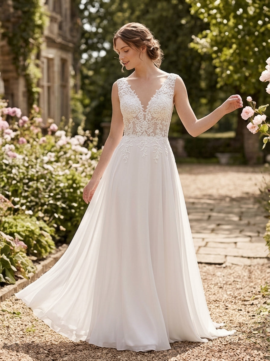 Lacey Bridal Ltd. Ambrosia chiffon A-line wedding gown with botanical lace bodice and plunge V-neckline in a garden