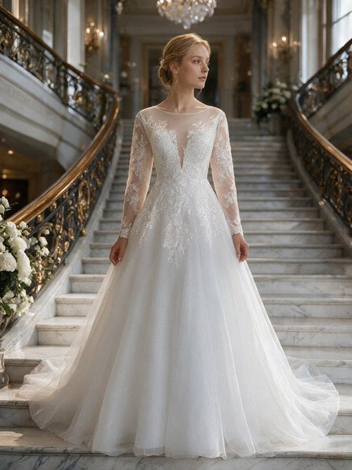 Lacey Bridal Ltd. Anastasia wedding dress with long illusion sleeves, floral lace bodice, and shimmering tulle skirt.