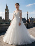 Lacey Bridal Ltd. ANNA ball gown with illusion bodice, long lace sleeves, and voluminous tulle skirt in London.