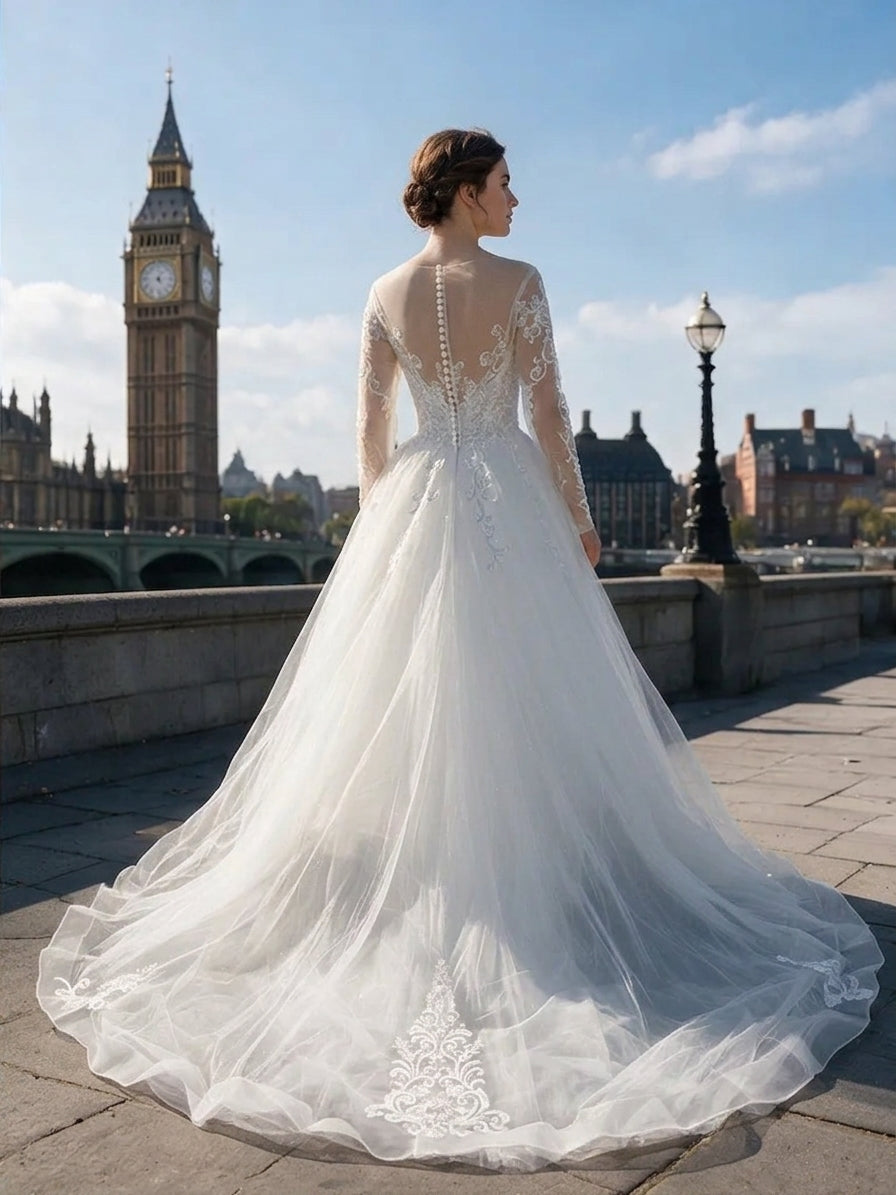 Lacey Bridal Ltd. ANNA ball gown with illusion back, long sleeves, lace embroidery, and tulle train in London.