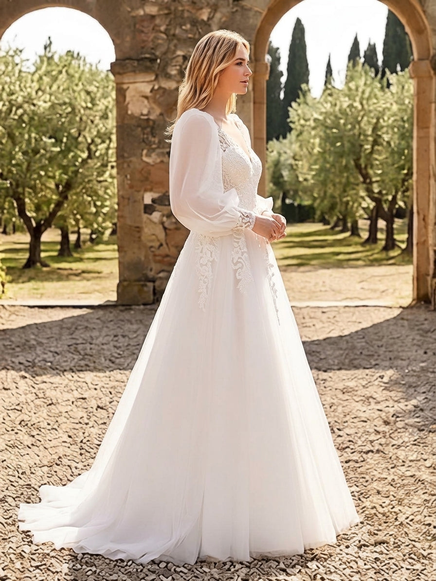 Lacey Bridal Ltd. Anthea A-line wedding gown with balloon sleeves, floral lace bodice, and flowing tulle skirt.