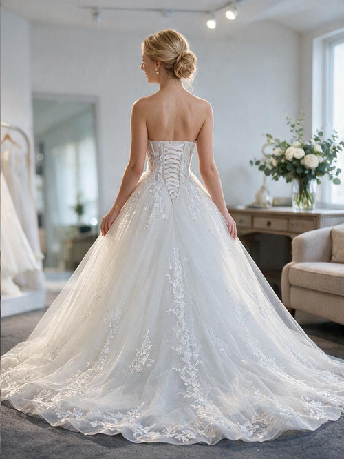Lacey Bridal Ltd. Araminta strapless A-line wedding gown with lace-up corset back and botanical embroidered tulle skirt