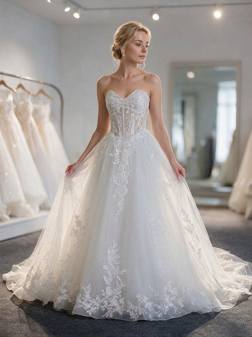 Lacey Bridal Ltd. Araminta strapless A-line wedding gown with lace bodice, tulle skirt, and botanical embroidery.