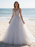 Lacey Bridal Ltd. Aurelia A-line wedding dress with sequin leaf motifs, v-neck bodice, and glitter tulle skirt.