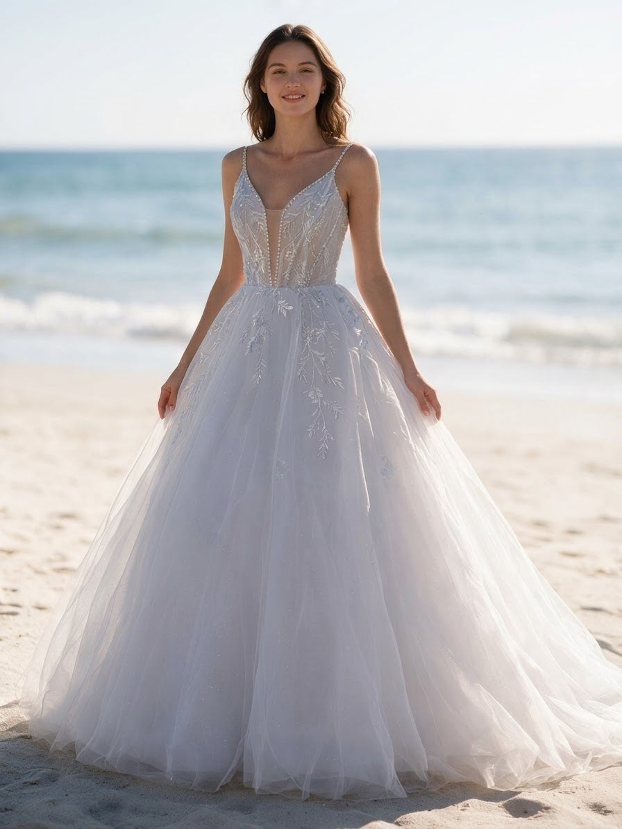 Lacey Bridal Ltd. Aurelia A-line wedding dress with sequin leaf motifs, v-neck bodice, and glitter tulle skirt.