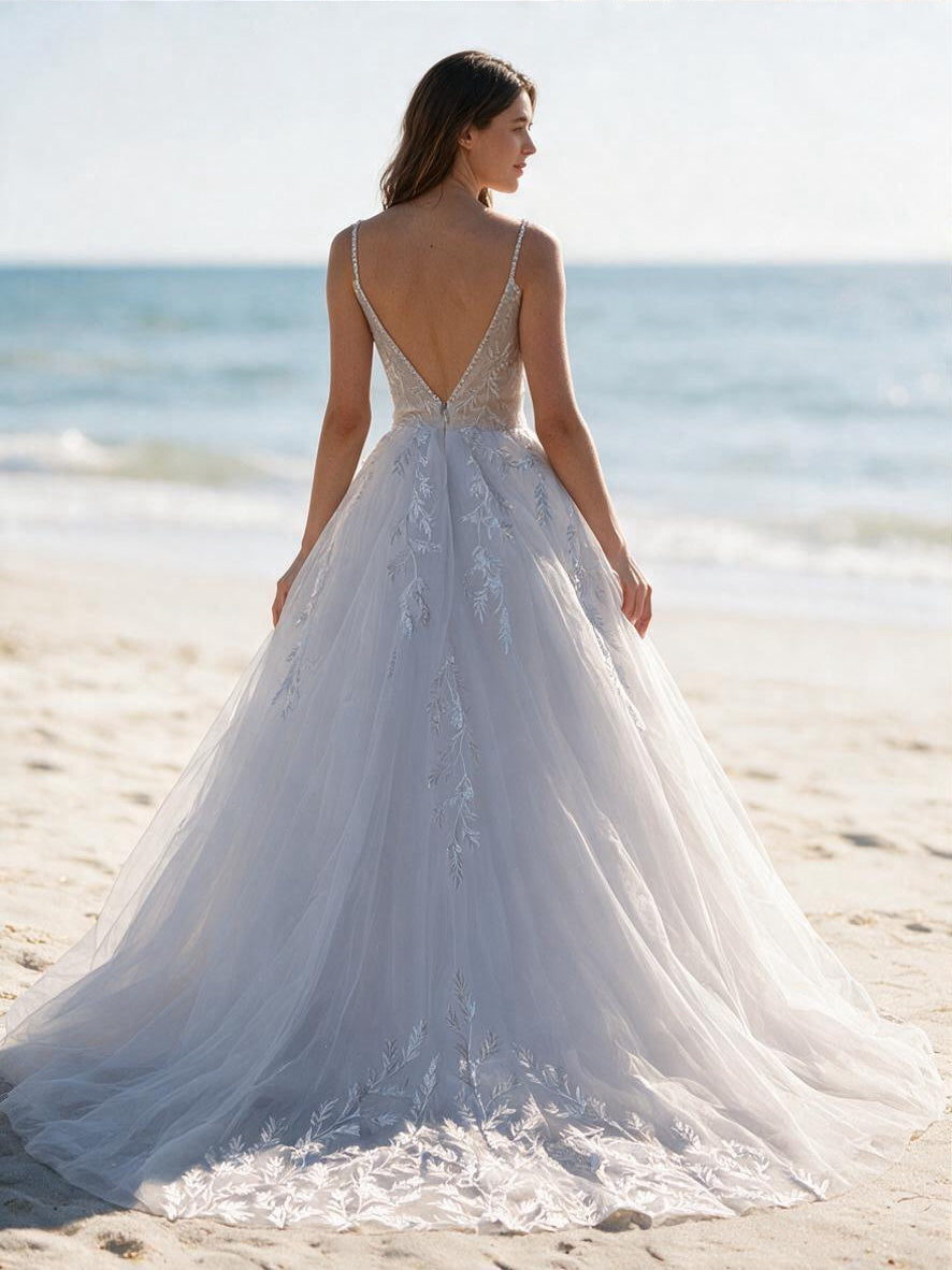 Lacey Bridal Ltd. Aurelia A-line wedding dress with sequin leaf motifs, illusion v-back, and glitter tulle skirt.