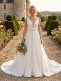 Lacey Bridal Ltd. AURORABELLE ivory satin A-line wedding gown with crystal beaded V-neck and embroidered waist belt.