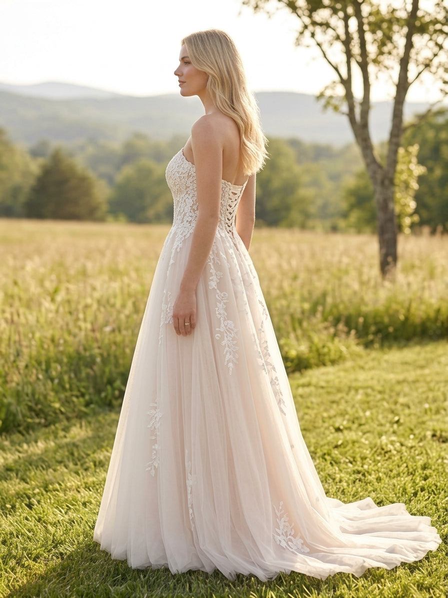 Lacey Bridal Ltd. Sibylla blush A-line wedding gown with floral lace bodice, sweetheart neckline, and tulle skirt.