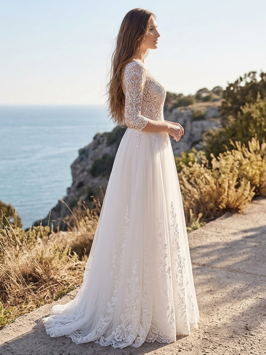 Lacey Bridal Ltd. Clarissa A-line wedding gown with floral lace bodice, illusion sleeves, and flowing tulle skirt.