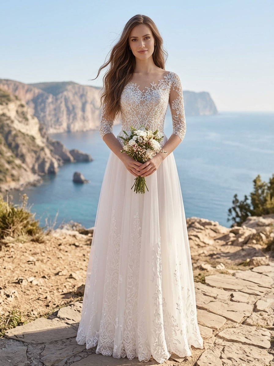 Lacey Bridal Ltd. Clarissa A-line wedding gown with illusion neckline, lace sleeves, and tulle skirt on a cliffside.