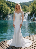 Lacey Bridal Ltd. ELIZA mermaid wedding gown with long illusion lace sleeves and sweetheart neckline by a waterfall.