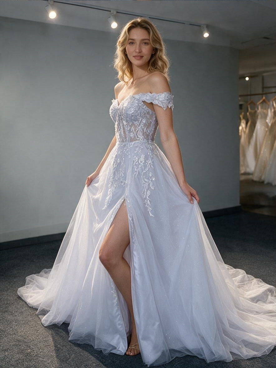 Lacey Bridal Ltd. Elysian A-line wedding dress with off-the-shoulder botanical lace bodice and tulle skirt with slit