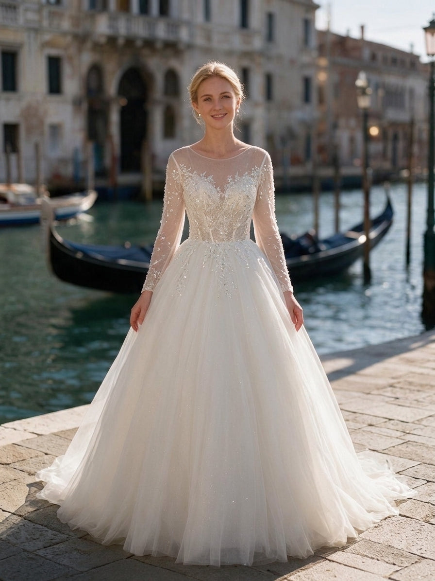 Lacey Bridal Ltd. Eudora ballgown wedding dress with long sheer sleeves, crystal beading, and a full tulle skirt.