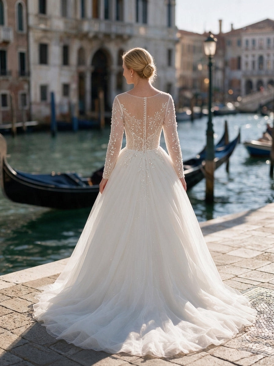 Lacey Bridal Ltd. Eudora ballgown wedding dress with long sheer beaded sleeves and illusion back in Venice