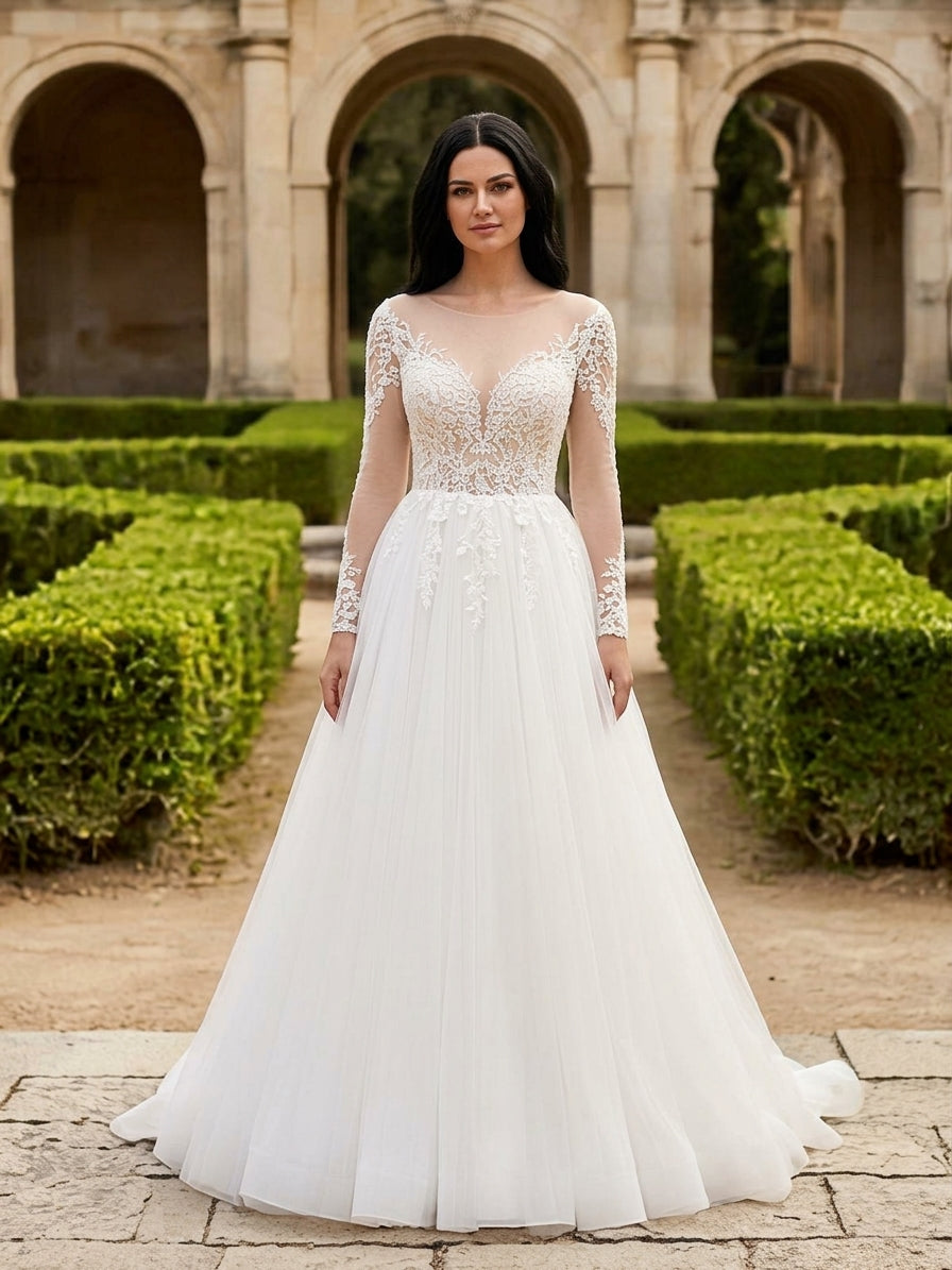 Lacey Bridal Ltd. EVA A-line wedding gown with illusion neckline, long lace sleeves, and a flowing tulle skirt.