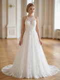 Lacey Bridal Ltd. EVADNE A-line wedding gown with illusion halter neck, floral lace bodice, and flowing tulle skirt.