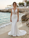 Lacey Bridal Ltd. FLORA crepe sheath wedding gown with 3D floral lace corset bodice and plunging V-neckline on beach