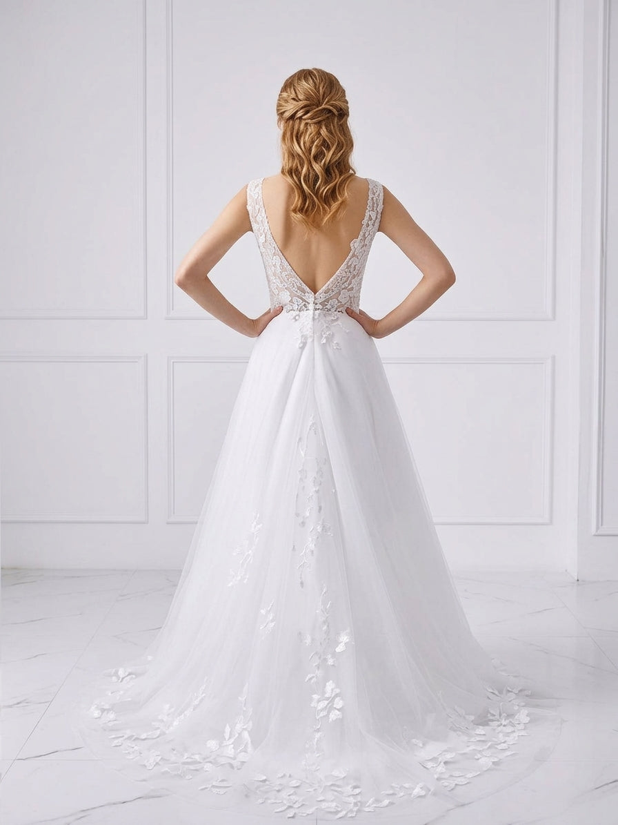 Back view of Lacey Bridal Ltd. Francesca A-line wedding gown with low V-back, floral lace appliqué, and tulle skirt.