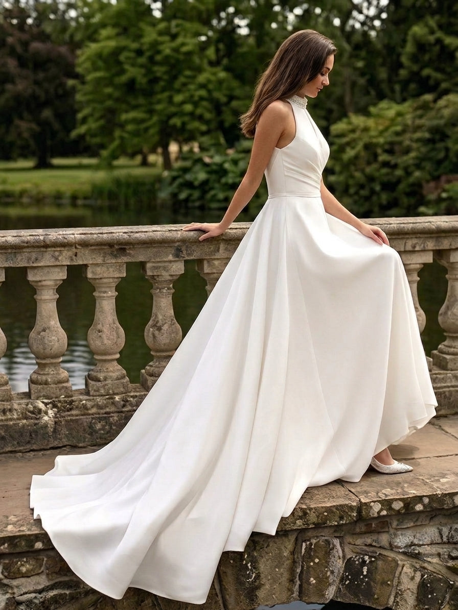 Lacey Bridal Ltd. Georgina A-line wedding gown with halter neck, pearl beading, and side split in white crepe