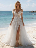Lacey Bridal Ltd. Isabella A-line wedding gown with floral embroidery, cold-shoulder lace cuffs, and tulle skirt.