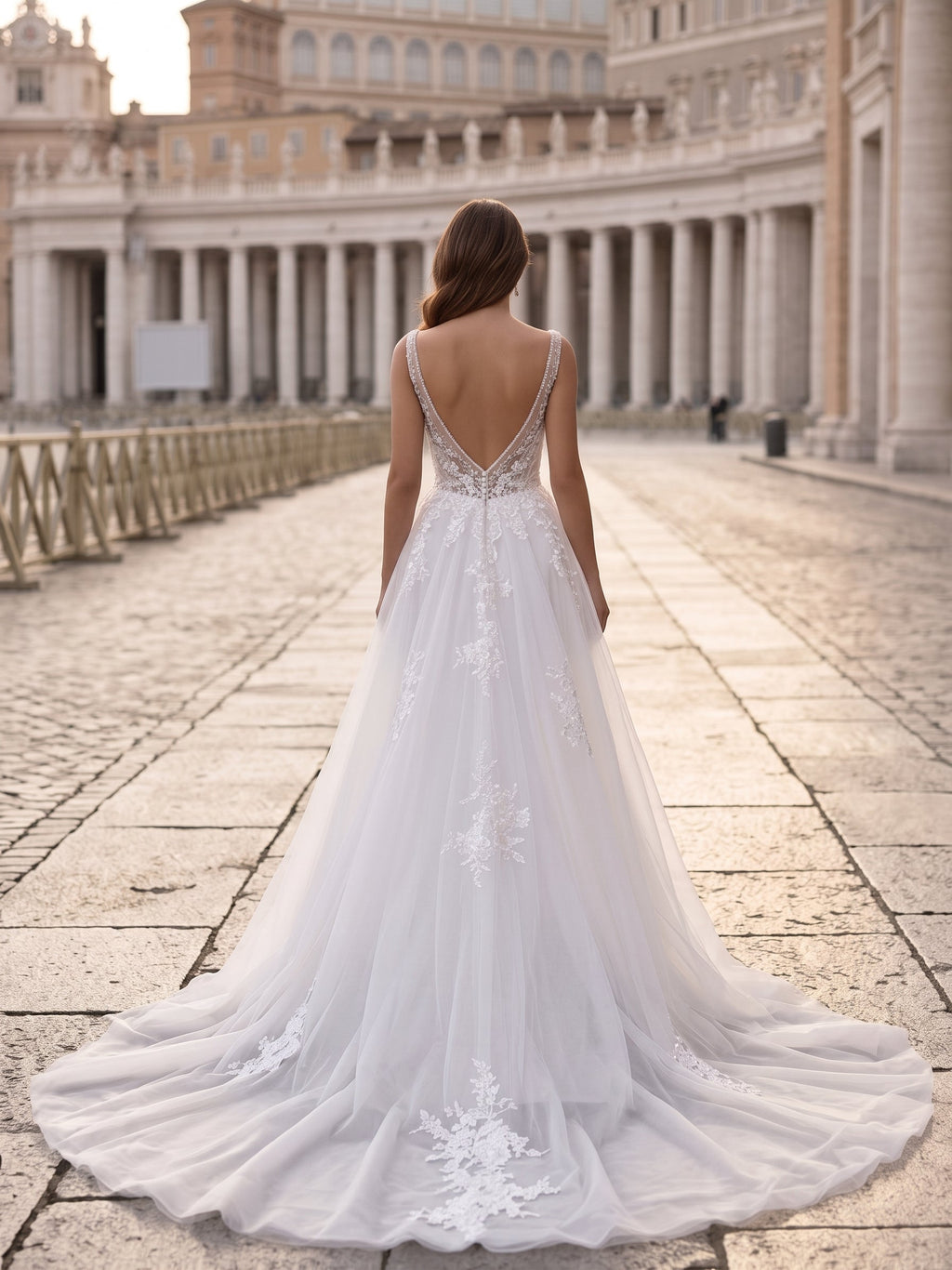Lacey Bridal Ltd. JACQUELINE wedding gown with low illusion V-back, lace appliqués, and detachable tulle train.