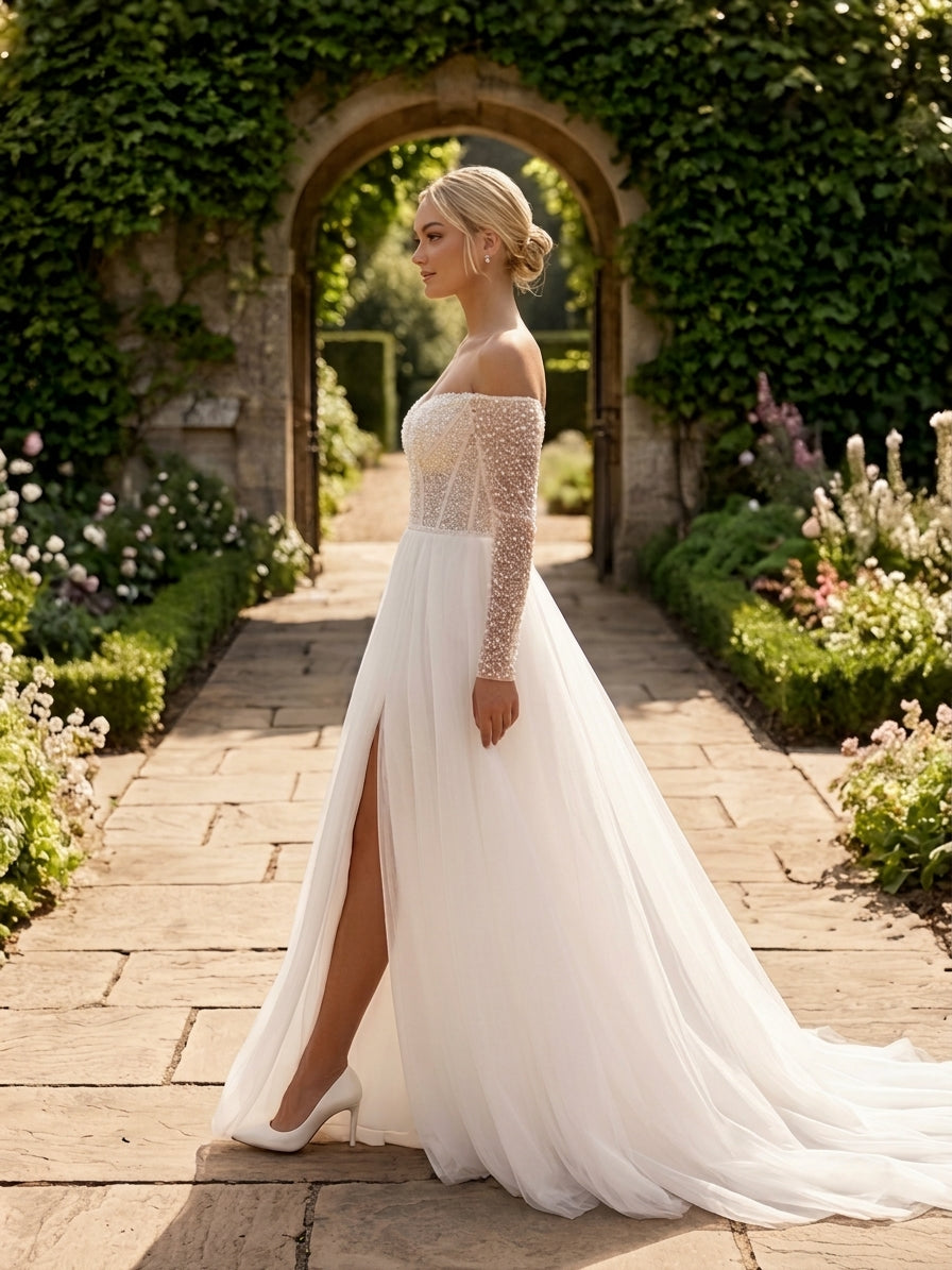 Lacey Bridal Ltd. Juliana A-line wedding gown with pearl-beaded corset bodice, illusion sleeves, and tulle skirt.