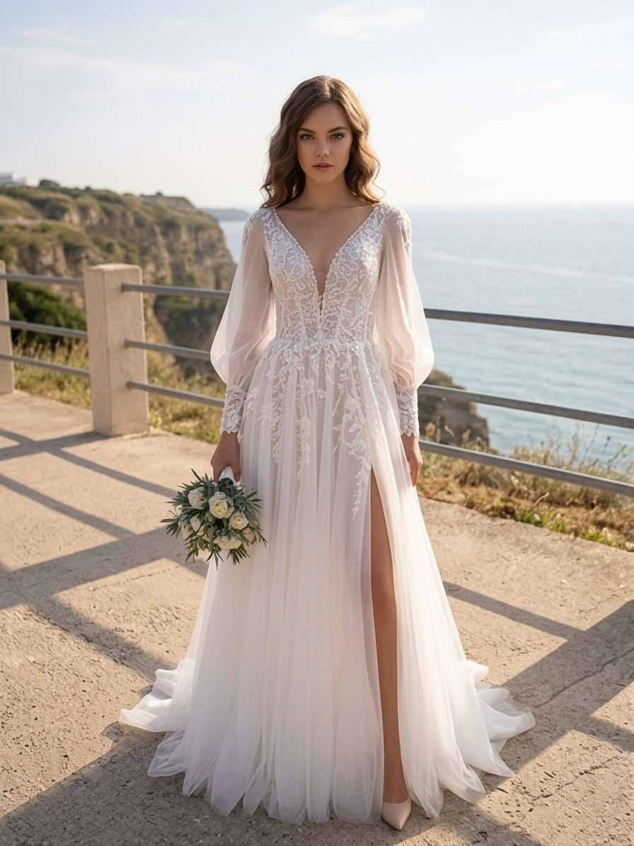 Lacey Bridal Ltd. Lucinda A-line wedding gown with floral lace bodice, sheer sleeves, and tulle skirt with thigh split.