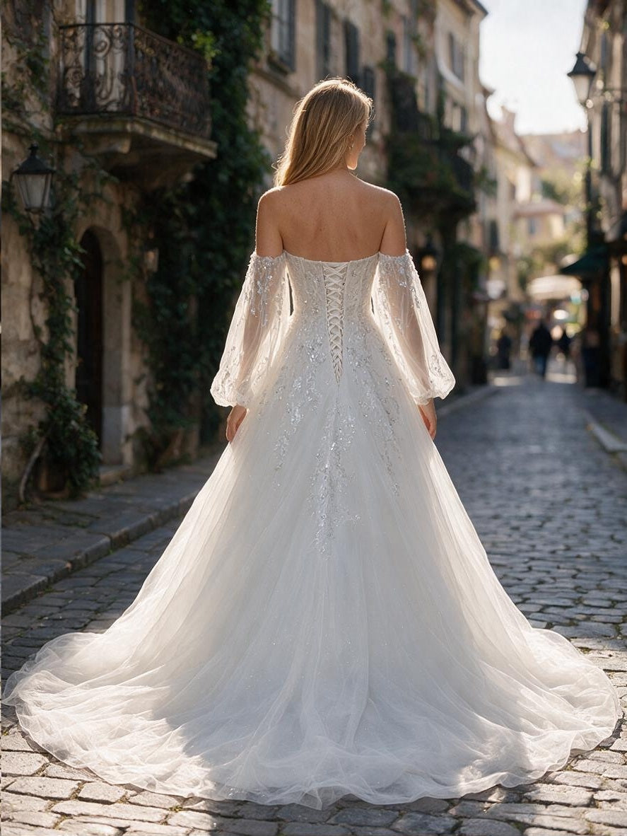 Lacey Bridal Ltd. Marcella A-line wedding gown with floral embroidery, bishop sleeves, and corset lace-up back.