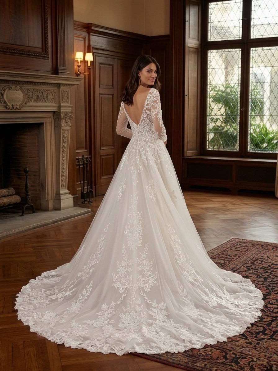 Lacey Bridal Ltd. Melissa A-line wedding gown with long illusion lace sleeves, low V-back, and tulle train.