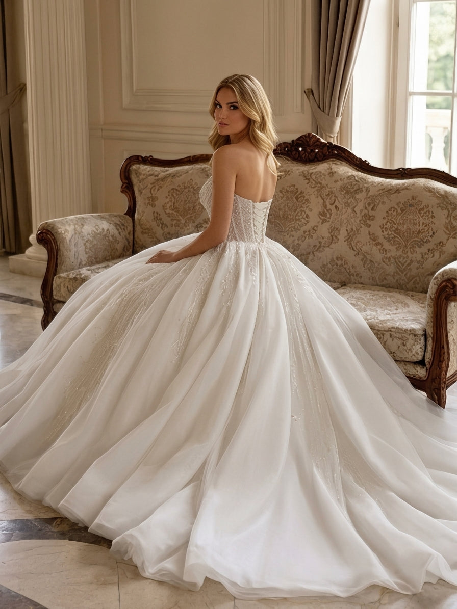 Lacey Bridal Ltd. Nerissa ball gown with strapless sweetheart corset bodice, beaded tulle skirt, and lace-up back.