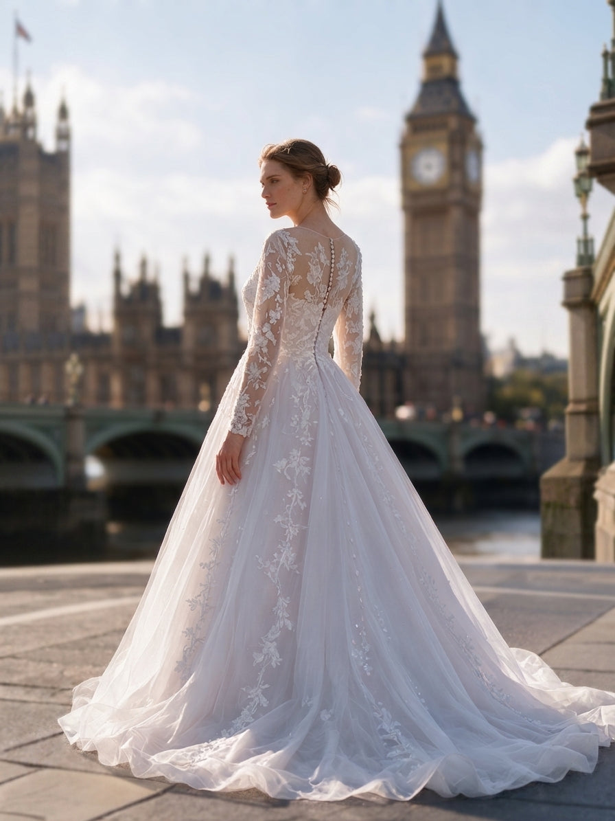 Lacey Bridal Ltd. Octavia A-line wedding gown with long illusion sleeves, botanical lace, and shimmer tulle skirt.