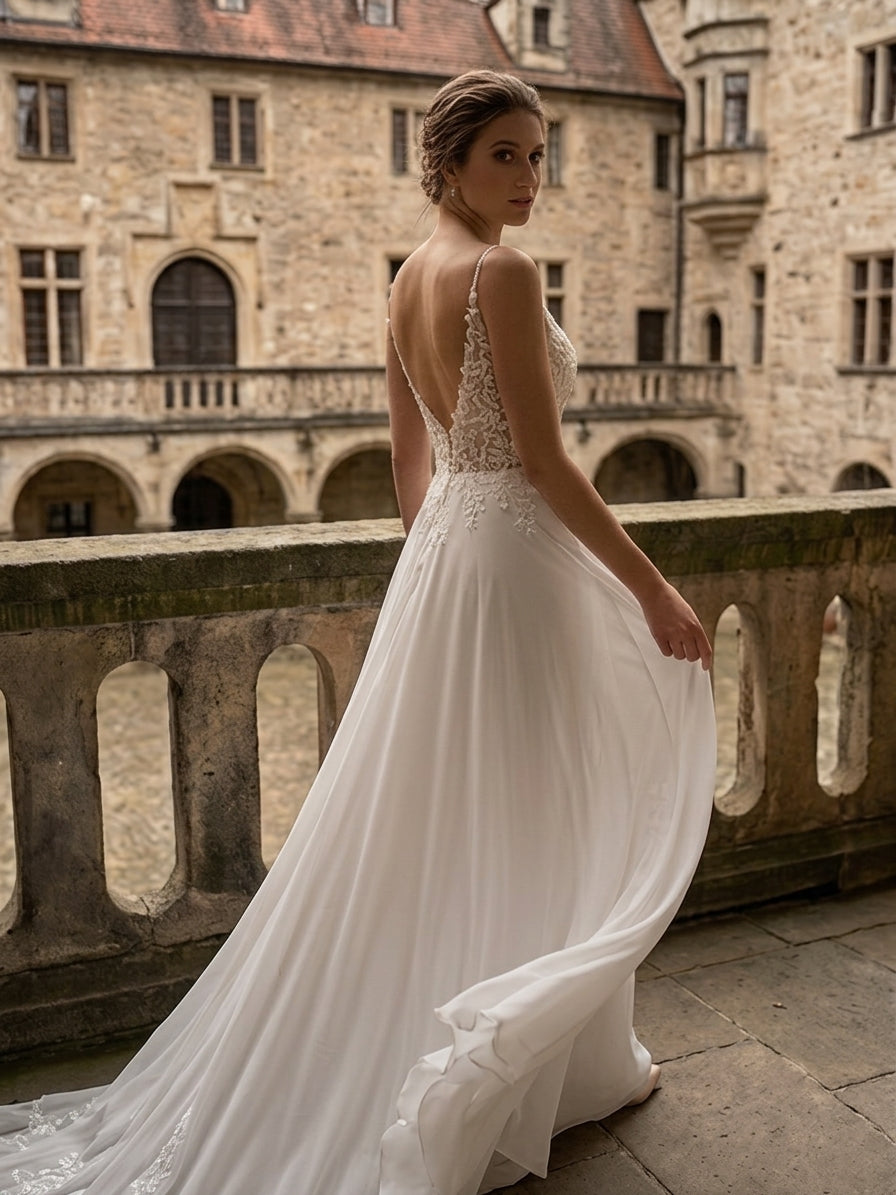 Lacey Bridal Ltd. Ophelia chiffon A-line wedding gown with lace bodice, V-back, and train at a historic estate.