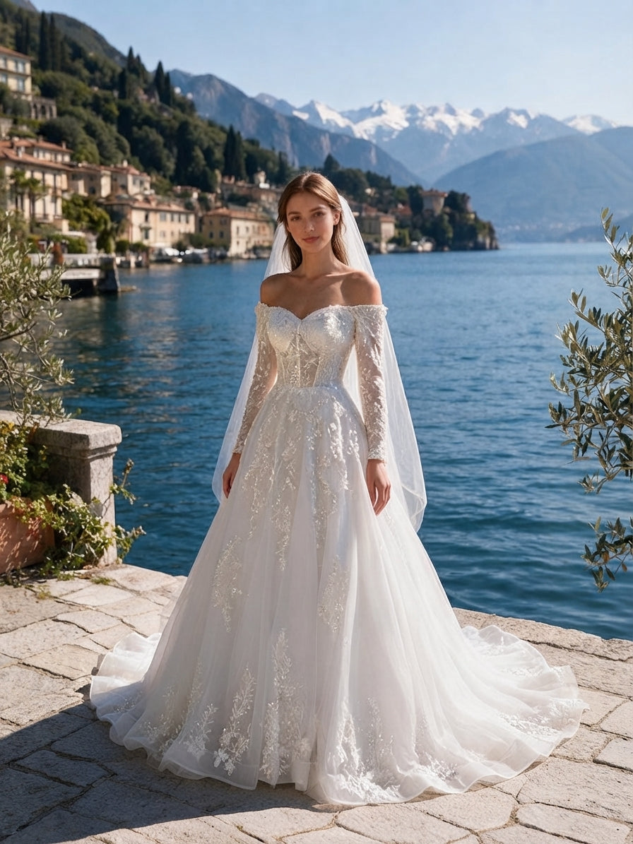 Lacey Bridal Ltd. OTTAVIA off-the-shoulder A-line wedding gown with floral lace, long sleeves, and tulle skirt.