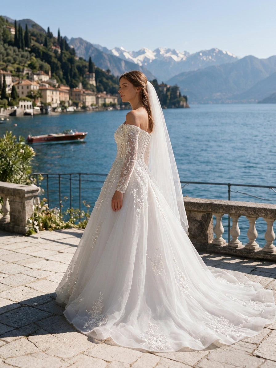 Lacey Bridal Ltd. OTTAVIA off-the-shoulder A-line wedding gown with floral lace sleeves and tulle skirt by the lake