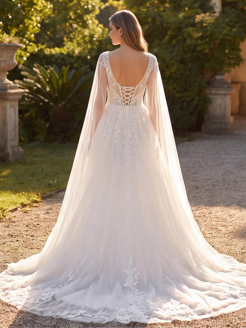 Lacey Bridal Ltd. Patricia A-line wedding gown with sheer tulle wings, floral lace bodice, and corset back