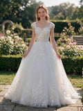 Lacey Bridal Ltd. Rosalba A-line wedding gown with floral lace bodice, cap sleeves, and shimmering tulle skirt.