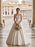 Lacey Bridal Ltd. Dominique satin A-line wedding gown with sweetheart neckline and corset bodice in Rome
