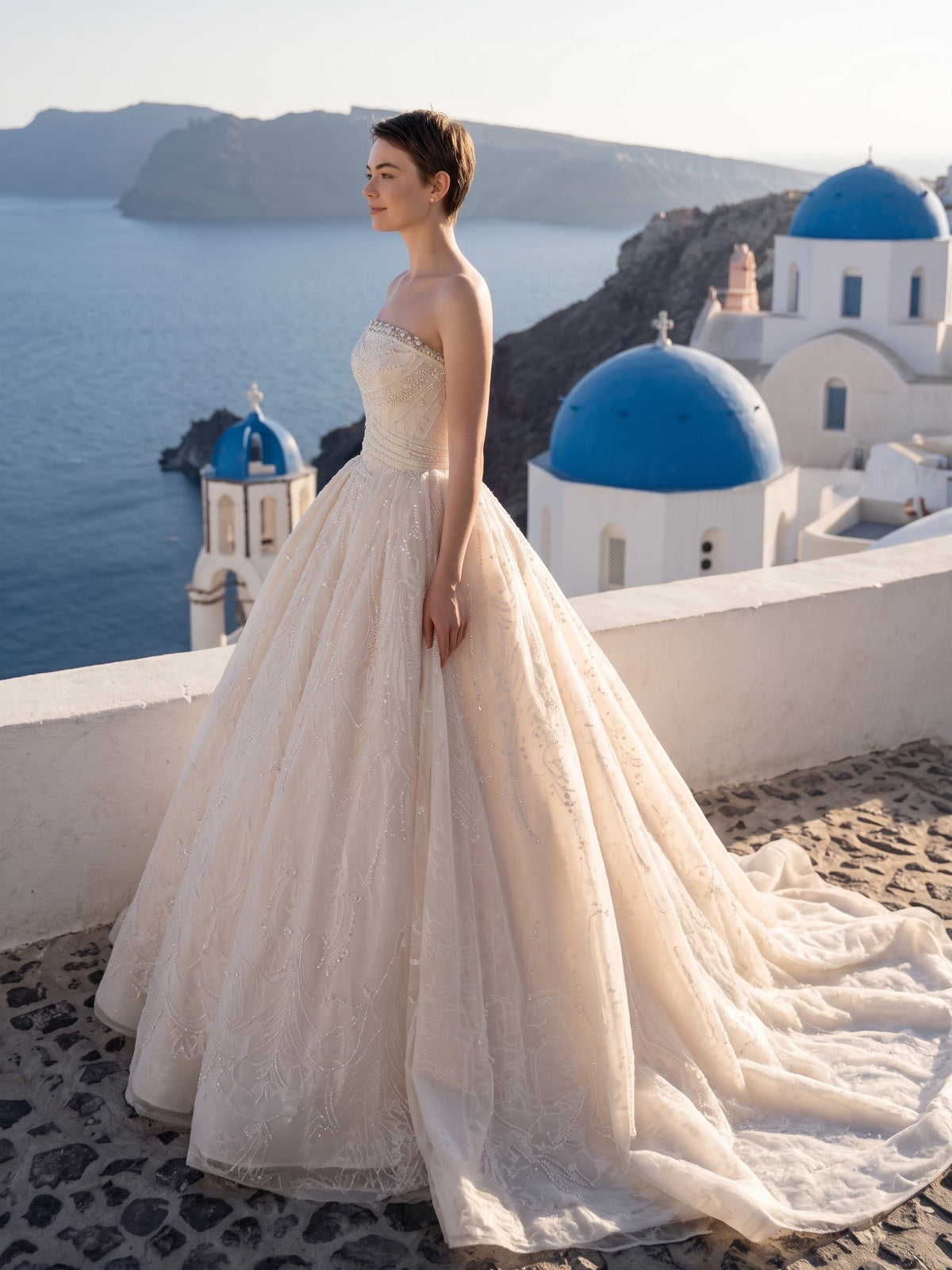 Lacey Bridal Ltd. Seraphine blush-champagne tulle ball gown with pearl-beaded corset bodice and sweeping train.