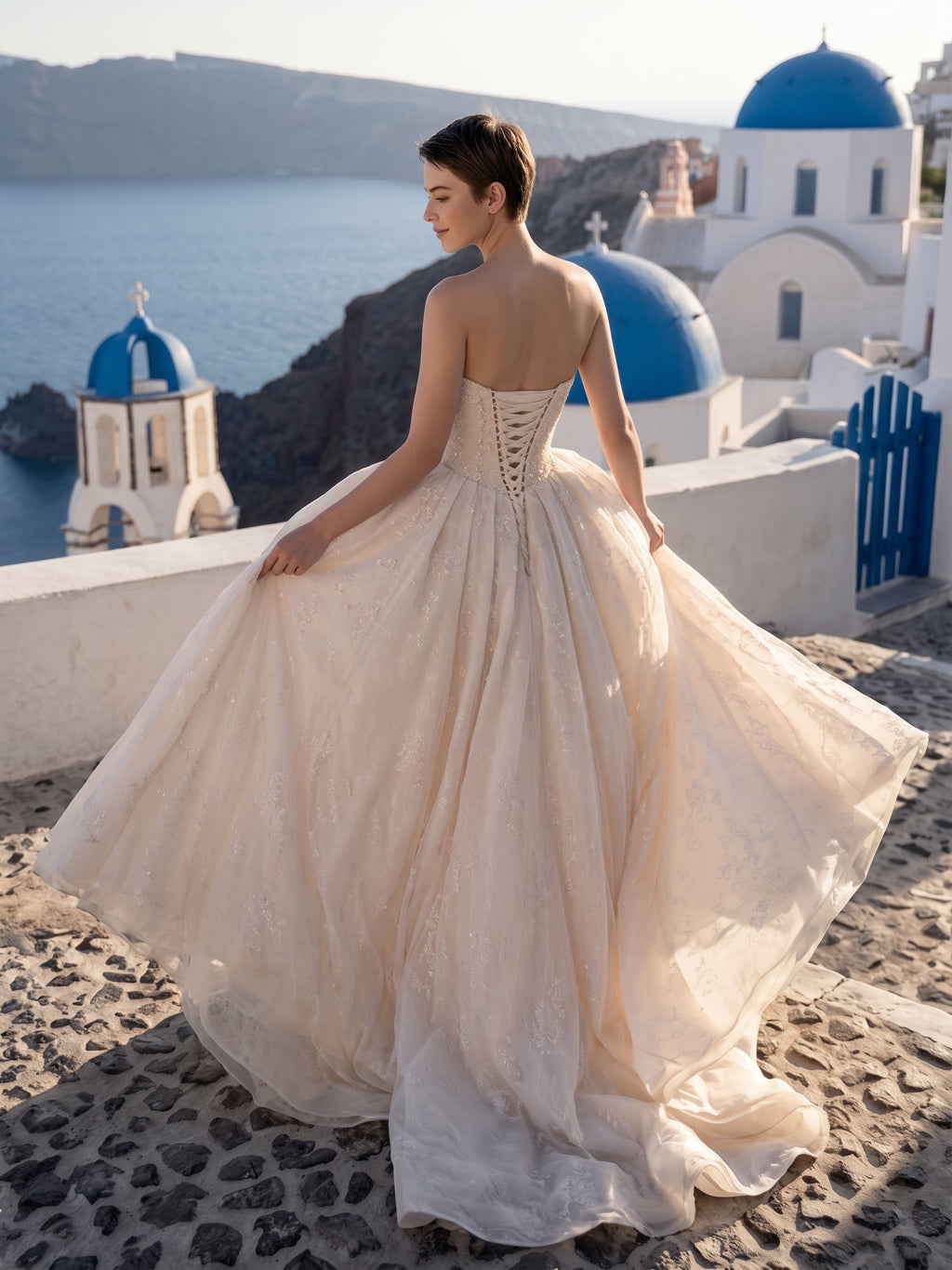 Lacey Bridal Ltd. Seraphine blush-champagne tulle ball gown with pearl corset bodice and lace-up back in Santorini.