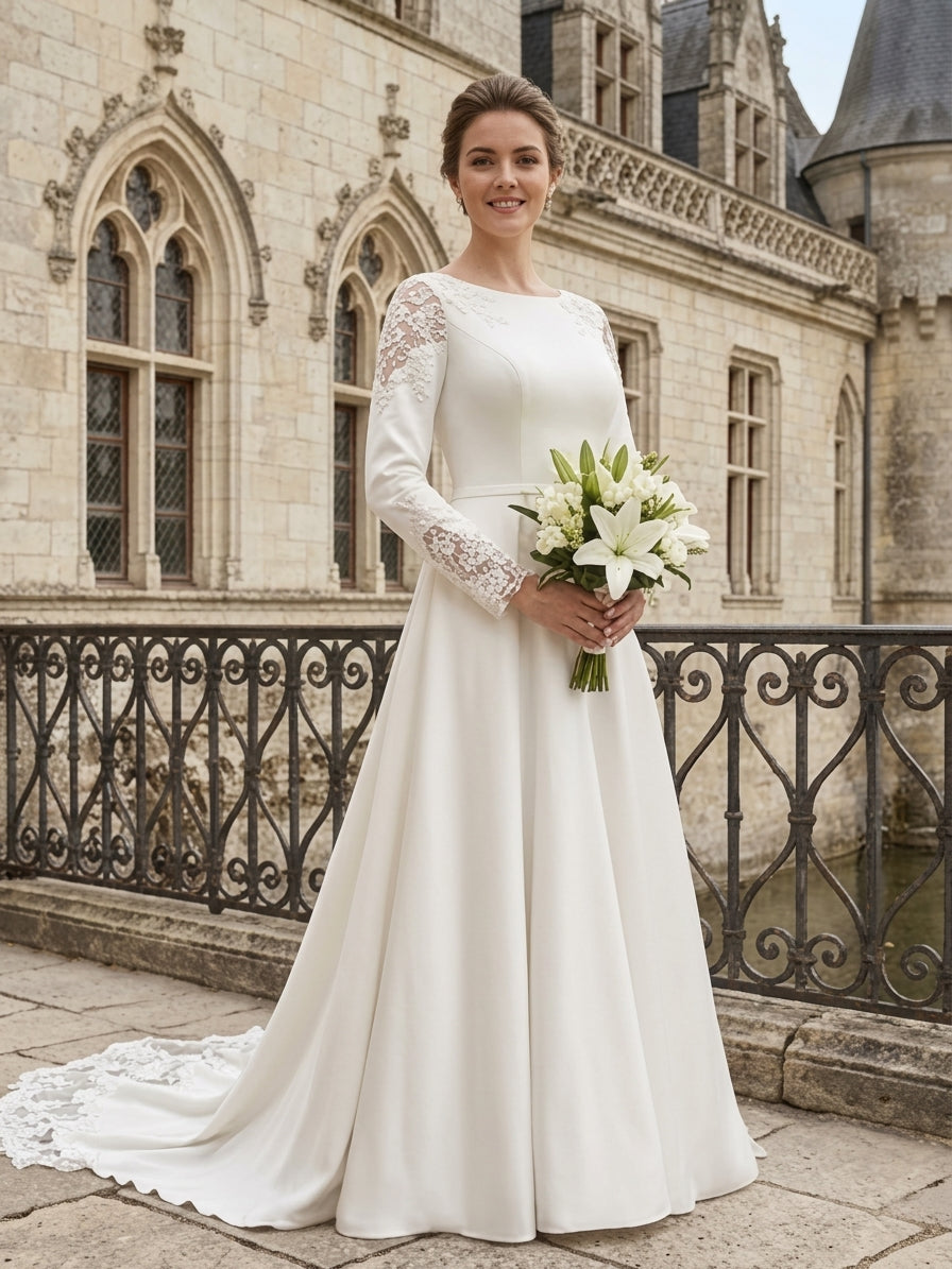 Lacey Bridal Ltd. Tatiana minimalist A-line wedding gown with long lace sleeves and boat neckline in a castle setting
