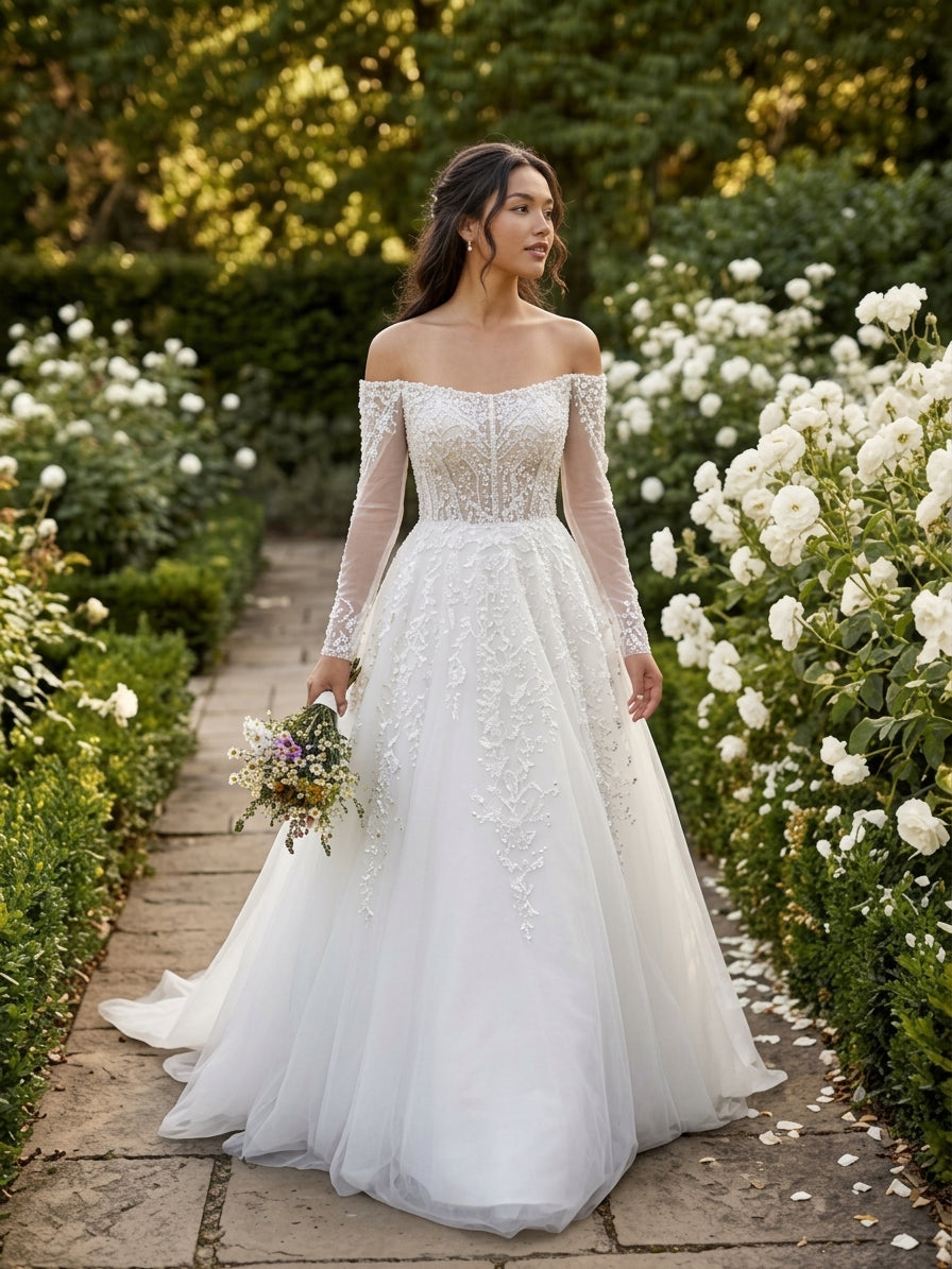 Lacey Bridal Ltd. TERESA A-line wedding gown with off-the-shoulder neckline, long illusion sleeves, and tulle skirt.