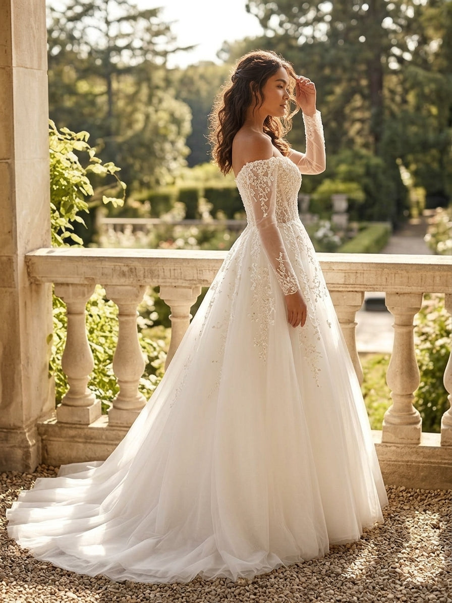 Lacey Bridal Ltd. Teresa off-the-shoulder A-line wedding gown with floral lace, illusion sleeves, and tulle skirt.