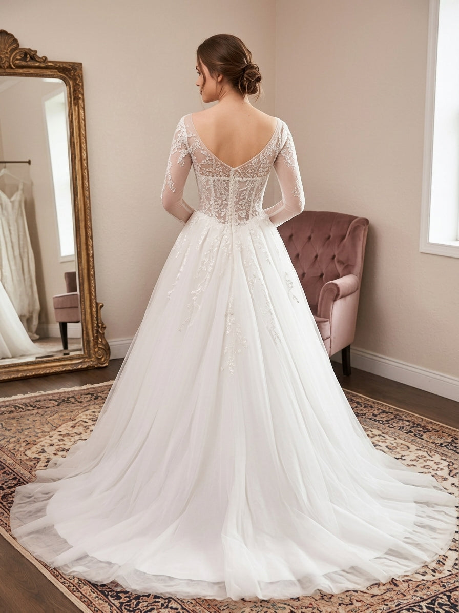 Lacey Bridal Ltd. Theodora wedding gown with long illusion sleeves, low V-back, and sequin tulle chapel-length train.