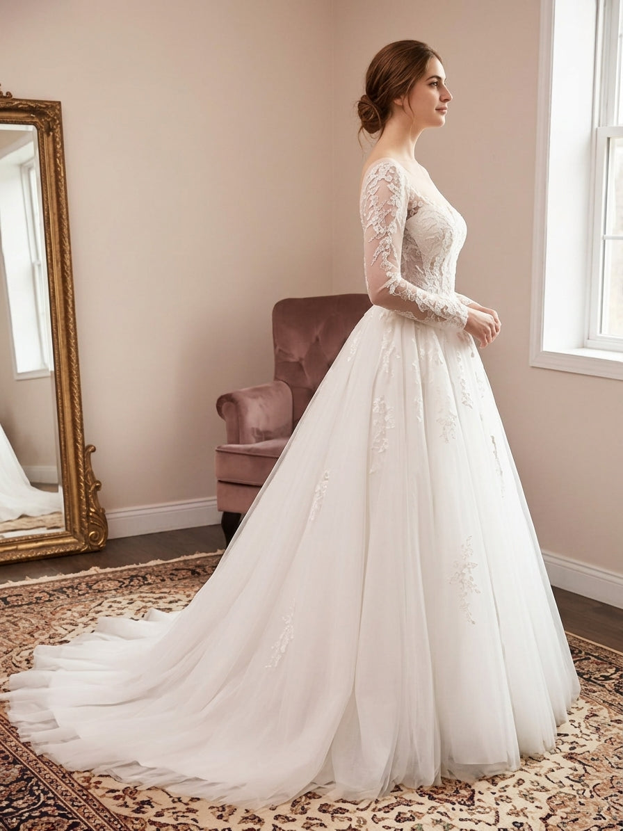 Lacey Bridal Ltd. Theodora wedding gown with long illusion sleeves, beaded embroidery, and a grand tulle chapel train.