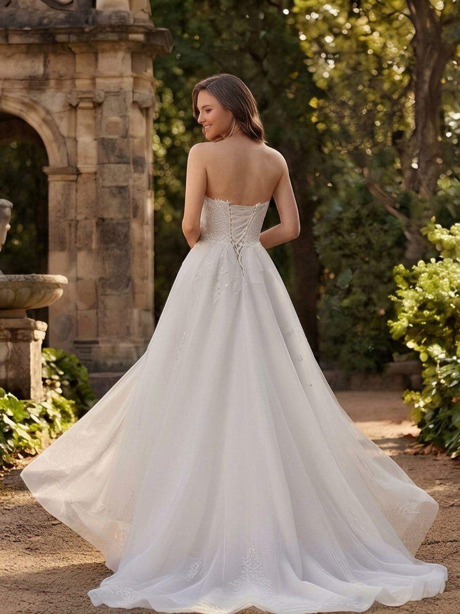 Lacey Bridal Ltd. Veronica strapless A-line wedding gown with floral lace bodice, corset back, and flowing tulle skirt.