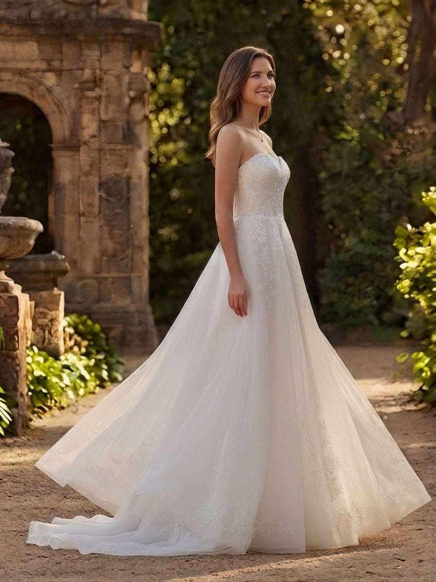 Lacey Bridal Ltd. Veronica A-line wedding gown with sweetheart neckline, floral lace bodice, and flowing tulle skirt.