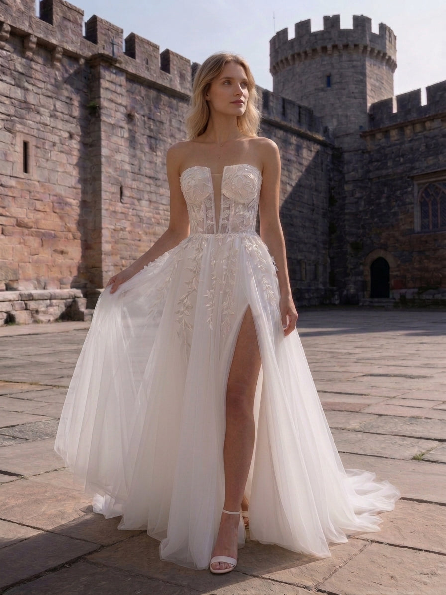 Lacey Bridal Ltd. Vivienne strapless A-line wedding gown with 3D floral lace, exposed boning, and high-slit tulle skirt