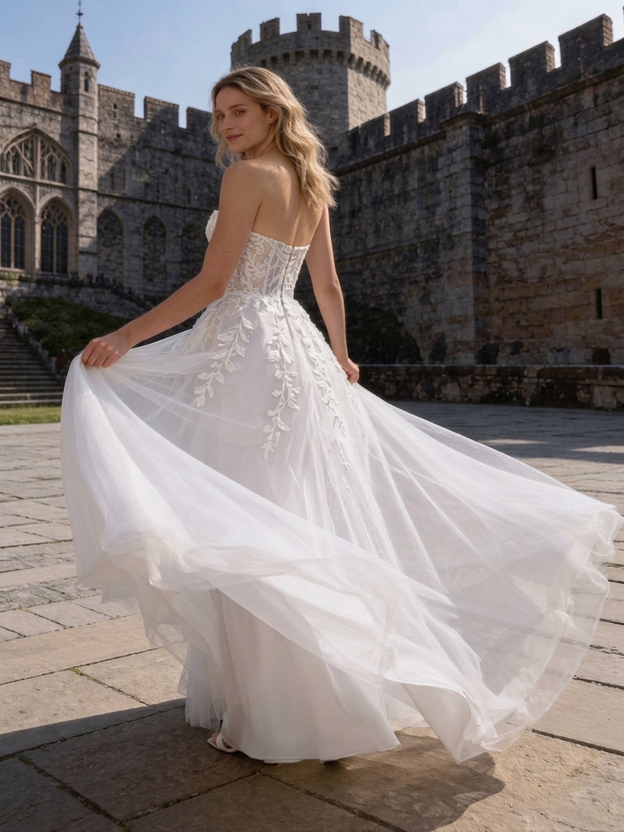 Lacey Bridal Ltd. VIVIENNE strapless A-line wedding gown with 3D floral lace, sheer boned bodice, and tulle train.