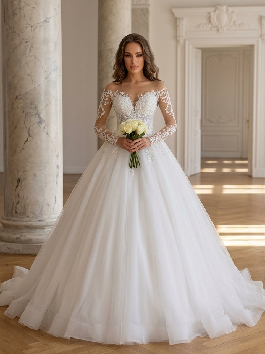 Lacey Bridal Ltd. Zelina ball gown with illusion long sleeves, lace appliqué, and a full tulle skirt in a ballroom.